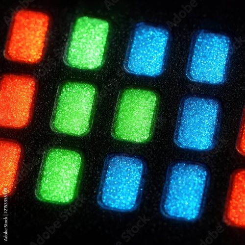 Extreme macro close up of glowing red green and blue display screen subpixels matrix array