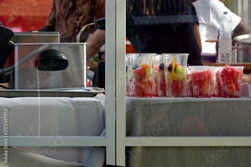 Festival refreshments in a food stall in form of fruit cups at Street Parade Zurich 2023.
