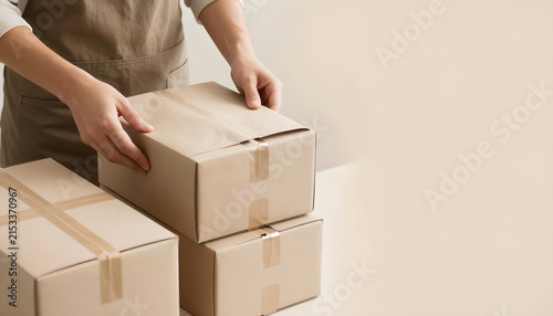 Worker Preparing Gift-Ready Boxes for Holiday Shipping: E-commerce Fulfillment