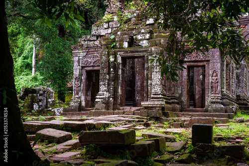 CHAMPASAK, LAOS – Ancient carved doorways and Buddha figures adorn the ruins of Vat Phou, a UNESCO World Heritage Khmer temple at the base of a mountain in southern Laos.