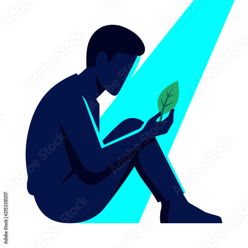 Man sitting and holding a green leaf in bright cyan beam light