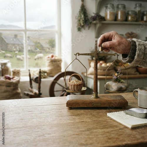 A person engaging in a daily activity in an agricultural landscape under natural daylight