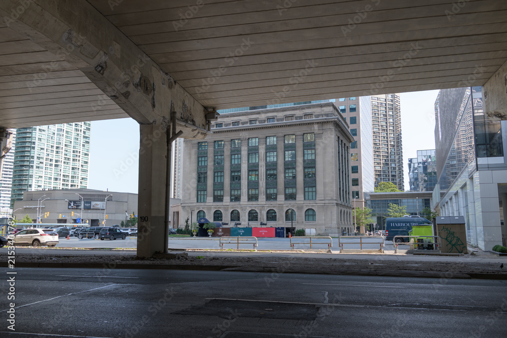 Fototapeta premium under-the-elevated-Gardiner Expressway view of Toronto Harbour Commission Building, completed in 1917, designed by Chapman & McGiffin in the Beaux-Arts style (north elevation)
