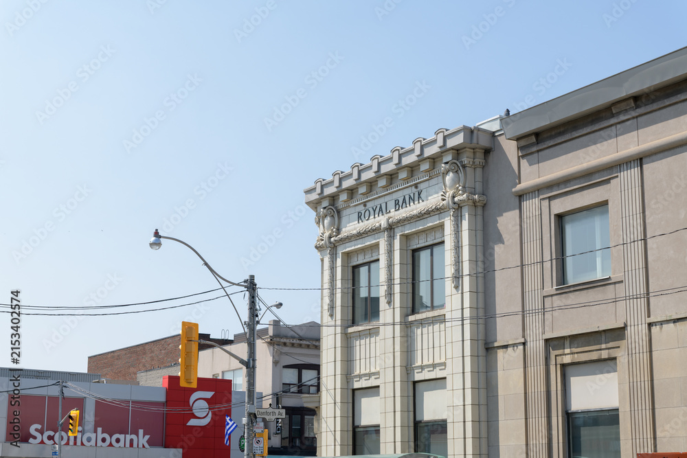 Fototapeta premium distant view of RBC Royal Bank (650 Danforth Av) and Scotiabank (649 Danforth Av) in Greek Town, Toronto