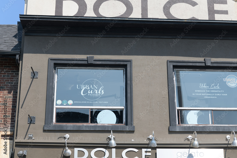 Fototapeta premium exterior building facade and signage of Dolce Gelato, an ice cream shop, located at 414 Danforth Av, Toronto