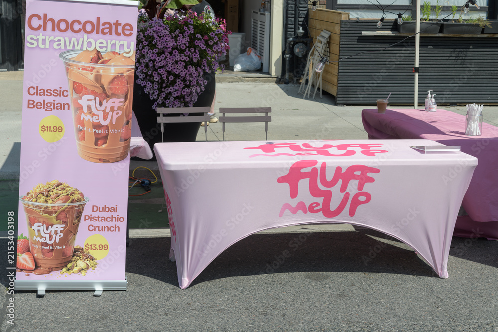 Fototapeta premium table outside Fluff Me Up, a coffee shop, located at 800 Danforth Av, during the Taste on the Danforth event 2026, Toronto