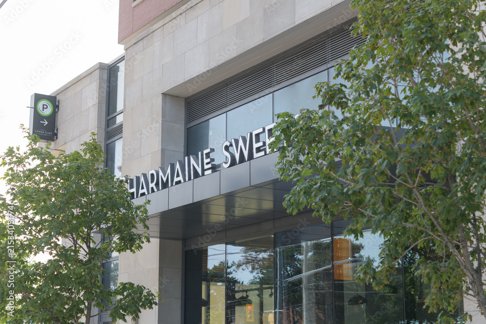 Fototapeta premium exterior building facade and sign of Charmaine Sweets, a bakery, located at 939 Eglinton Av E, East York, Toronto