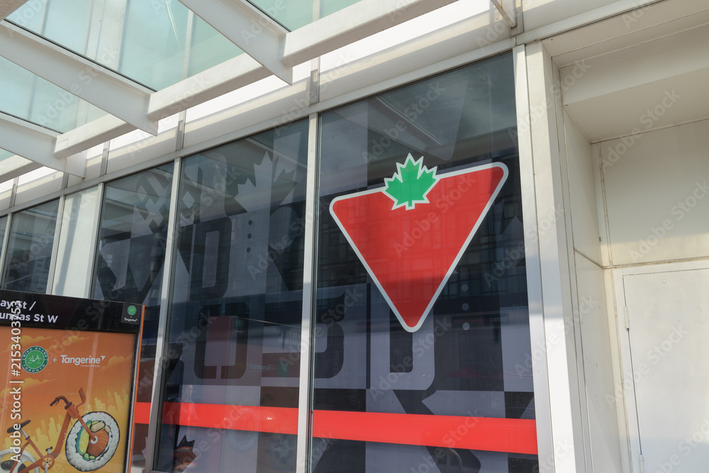 Fototapeta premium Bike Share Toronto docking station and logo of Canadian Tire, a department store, located at 65 Dundas St W, inside CF Toronto Eaton Centre complex