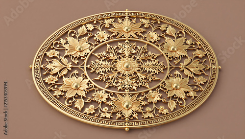 Ornate golden filigree metal decoration with floral pattern