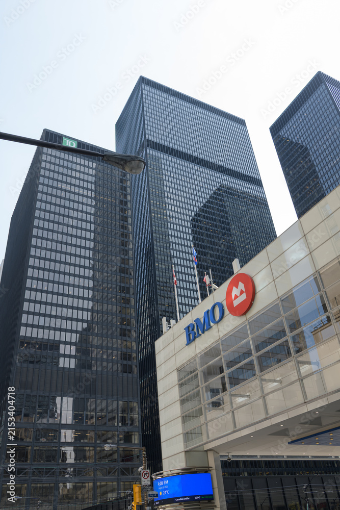 Fototapeta premium exterior building facade and corporate logo sign of BMO Financial Group outside headquarters at First Canadian Place, northwest corner of 100 King St W and Bay St, Toronto; Toronto-Dominion Centre