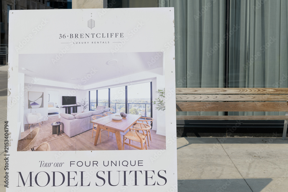 Fototapeta premium a-frame sidewalk sign near 36 Brentcliffe, a recently completed 20-storey residential tower in Leaside, developed by Camrost Felcorp, Toronto