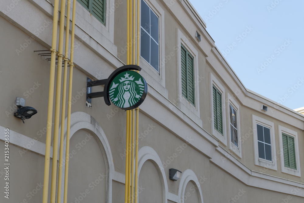 Fototapeta premium wall-mounted round projecting sign of Starbucks Coffee Company (at the rear of the shop) located at 65 Wicksteed Av, SmartCentres, East York, Toronto