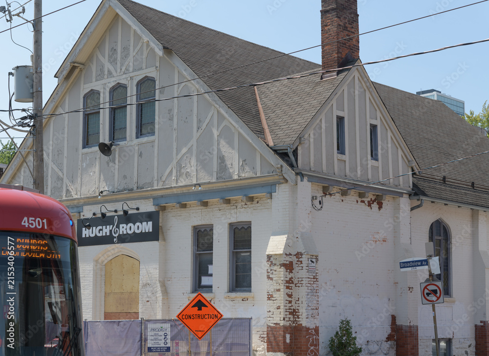 Fototapeta premium exterior building facade and sign of Hugh's Room Live, a music venue, and former place of worship, located at 296 Broadview Av, Toronto