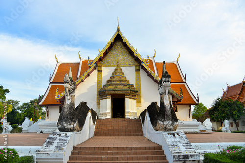 The historic Wat Phumin temple in Nan province, Thailand, showcasing traditional Lanna architecture and famous Naga serpent statues guarding the entrance.