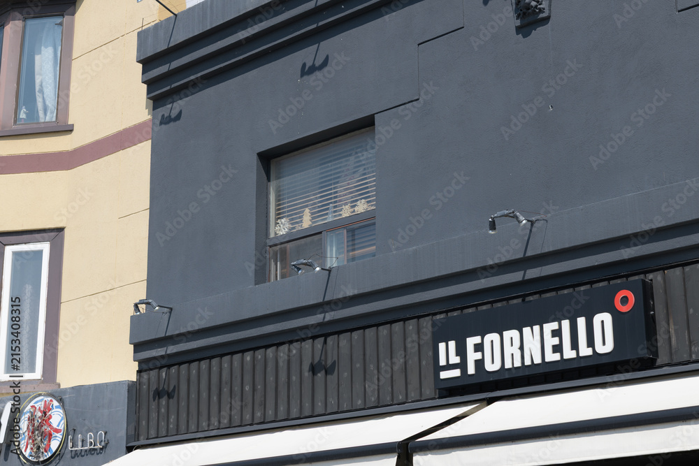 Fototapeta premium exterior building facade and sign of IL FORNELLO on Danforth, an Italian restaurant, located at 576 Danforth Av, Toronto