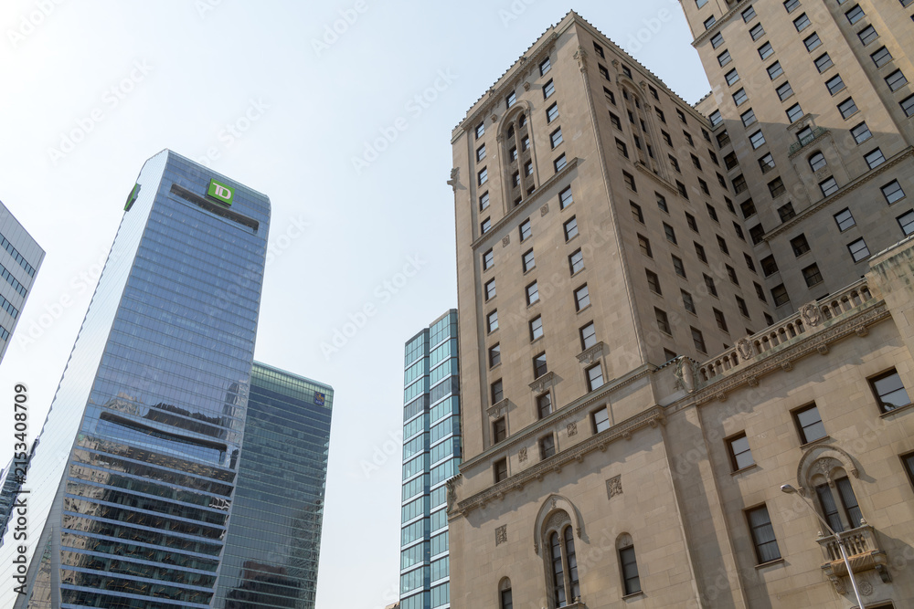 Fototapeta premium TD Terrace and the Châteauesque Fairmont Royal York at 100 Front St W, Toronto, designed by Ross and Macdonald (with Sproatt and Rolph) for the Canadian Pacific Railway as a grand hotel
