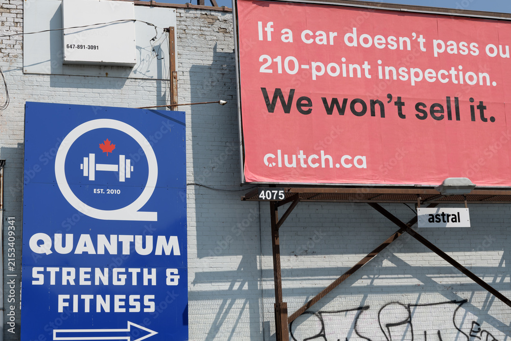 Fototapeta premium Quantum Strength & Fitness sign and roadside billboard for clutch dot ca near 995 Pape Av (East York), Toronto
