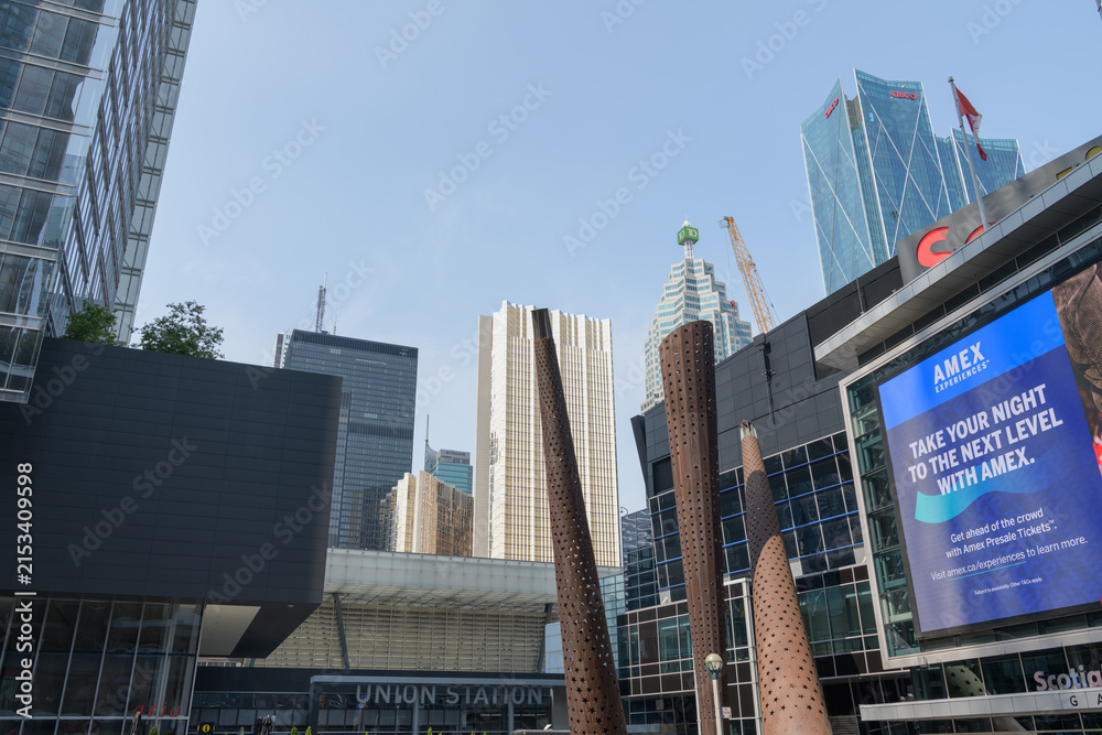 Fototapeta premium looking north from Maple Leaf Square outside Scotiabank Arena with digital billboard featuring advertisement by American Express, Toronto