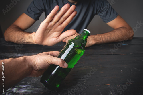 Caucasian man reject alcohol. No drinking