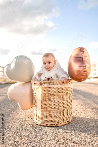 little girl with a basket of apples
