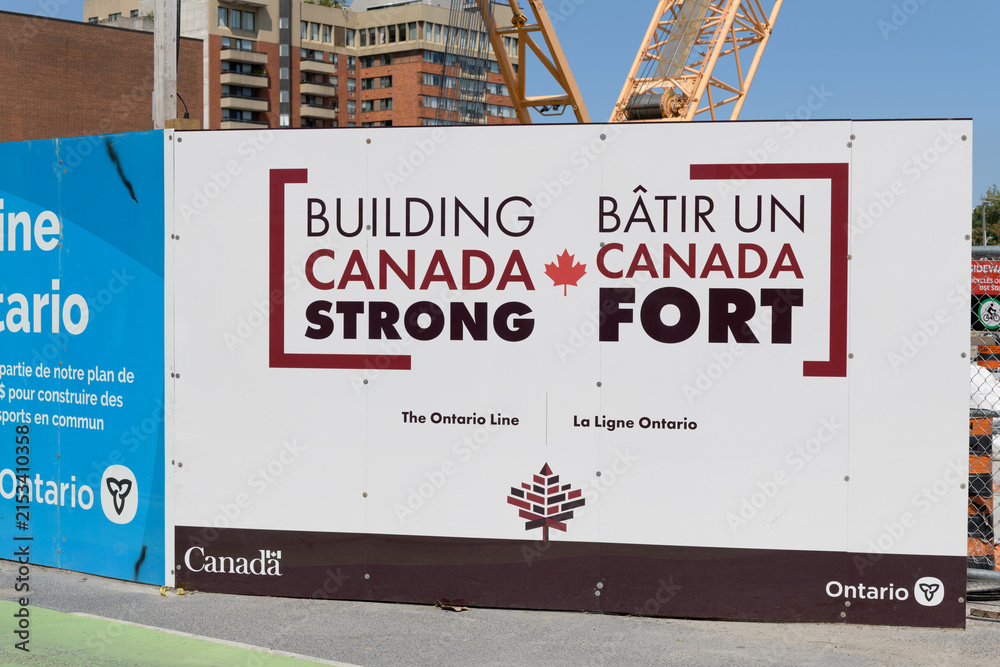 Fototapeta premium spanking new Gov of Canada Building Canada Strong sponsor hoarding sign outside Pape station Ontario Line/Line 2, Toronto