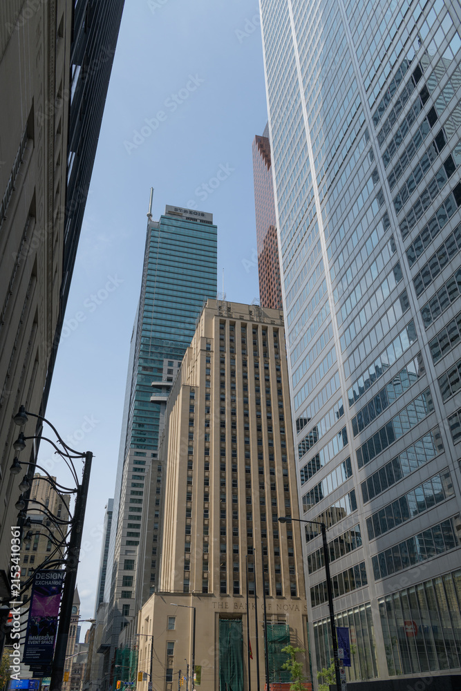 Fototapeta premium historic and contemporary office towers in Financial District Toronto (Bank of Nova Scotia, Commerce Court West and Toronto-Dominion Centre) or looking north on Bay St