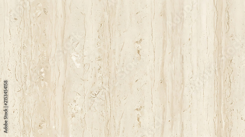 Close-up of elegant beige marble surface showcasing natural veins and textured patterns for interior design accents or