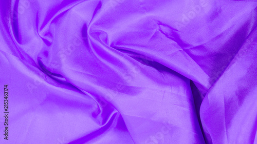 Obraz na płótnie purple silk fabric with volumetric wavy folds and glossy shine