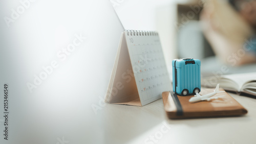 travel planning suitcase with vacation calendar; a suitcase and arranged for a future journey. travel guides buyer choices, planning frames the scene, and suitcase adds useful meaning.