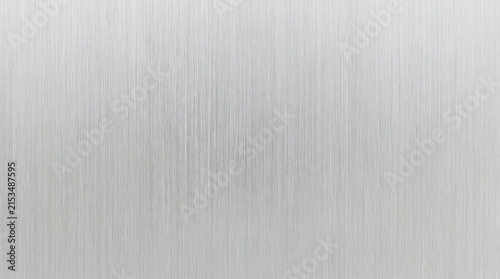 Close-up of brushed aluminum surface with fine linear texture and subtle reflective quality for industrial design or modern