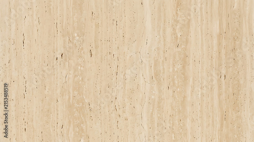 Close-up of beige textured stone surface with natural pattern and subtle cracks highlighting geological formations and surface