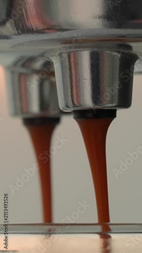 Espresso Extraction Flow Professional Machine Portafilter Double Spout Fresh Dark Coffee Liquid Pouring Macro Close Up Barista Brewing Process Cafe Restaurant Professional Equipment Vertical