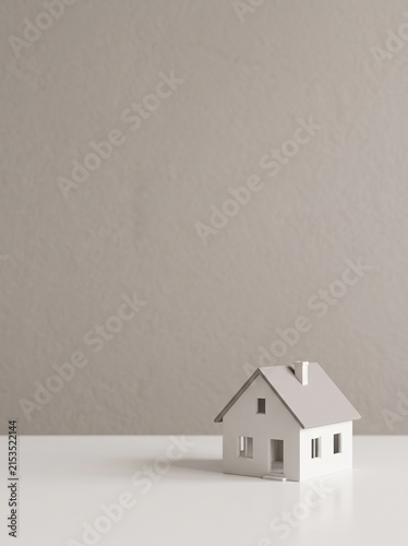 Minimal White Miniature House on Clean Table with Large Beige Copy Space for Real Estate, Mortgage, Property Investment, Home Ownership and Housing Advertising