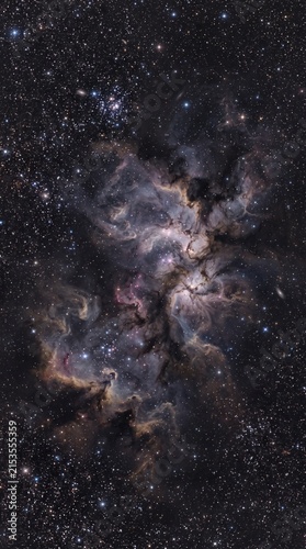 Cosmic nebula glowing in deep space with vibrant purple and pink interstellar dust clouds