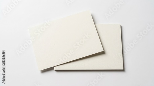Two blank white rectangular paper cards stacked on a clean light gray background for a professional minimalist branding design mockup presentation