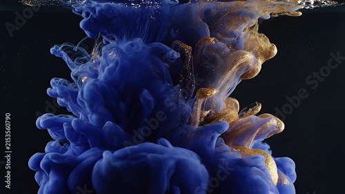 Blue and Gold Liquid Ink Diffusion in Water Abstract Background