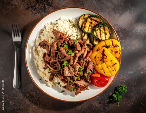Tender Shredded Meat Dish with Rice and Grilled Vegetables on a Rustic Table Setting