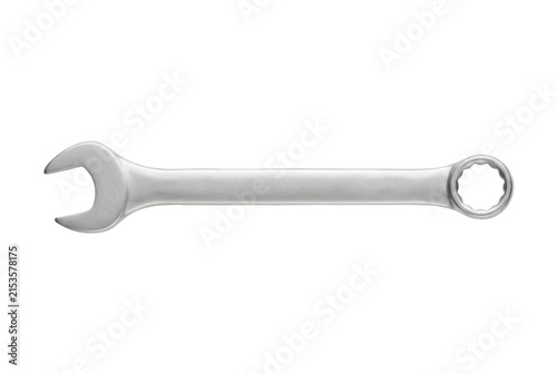 Steel combination spanner wrench on black background.