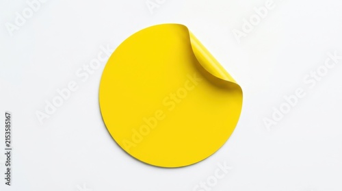 Blank yellow round sticker with a curled corner for notes or labels design isolated on a clean white background isolated on white background