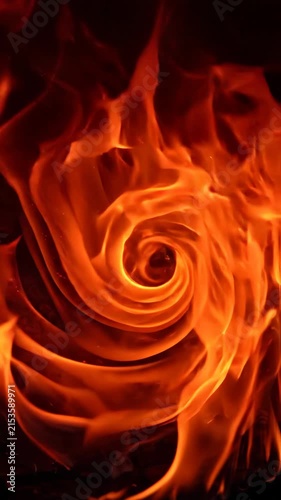Abstract fire flames swirling against a dark background creating a dynamic heat texture.