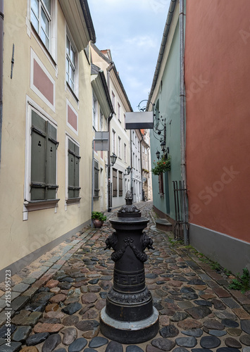 Historical cast iron water hydrant on medieval Troksnu Street in Old Town Riga, Latvia