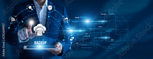 IT Administrator using tablet analysing Backup data. Data protection, disaster recovery, cloud storage, secure infrastructure, business continuity, information security.