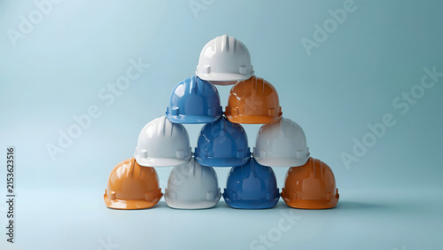 Pyramid Stack Of Colorful Construction Hardhats Representing Safety Teamwork Leadership And Building Industry Protection