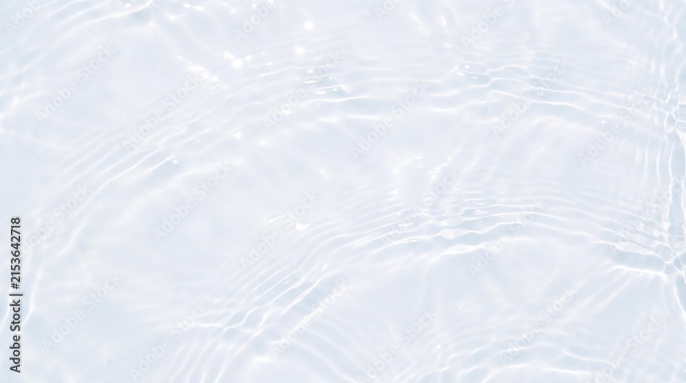 Obraz premium Clear Ripples on Calm Surface: Gentle, luminous ripples dance across a serene, pure water surface, reflecting subtle light patterns and evoking a sense of tranquility and refreshment.