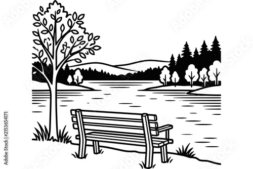 Wooden park bench overlooking a serene lake scene.