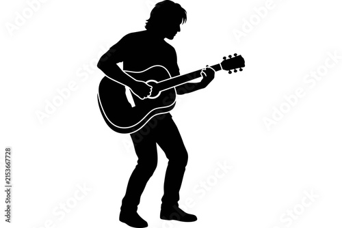 Silhouette of a man playing an acoustic guitar.