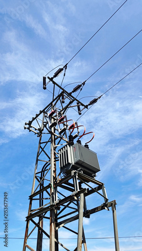 Electric utility pole located in the Czech Republic features a metal lattice structure supporting multiple high-voltage insulators and conductors.