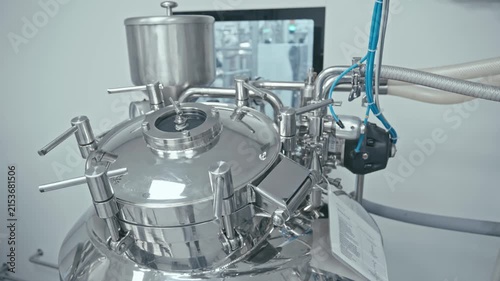Production equipment at medical industry. Pipes, valves, and gauges. Technology and automation. Factory machine at work. 4K, UHD