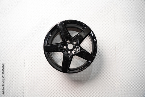 Fotografía Black alloy car wheel isolated on white background