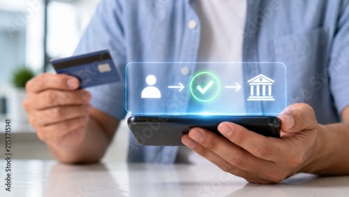 Person holding credit card using smartphone for secure online banking transaction identity verification process